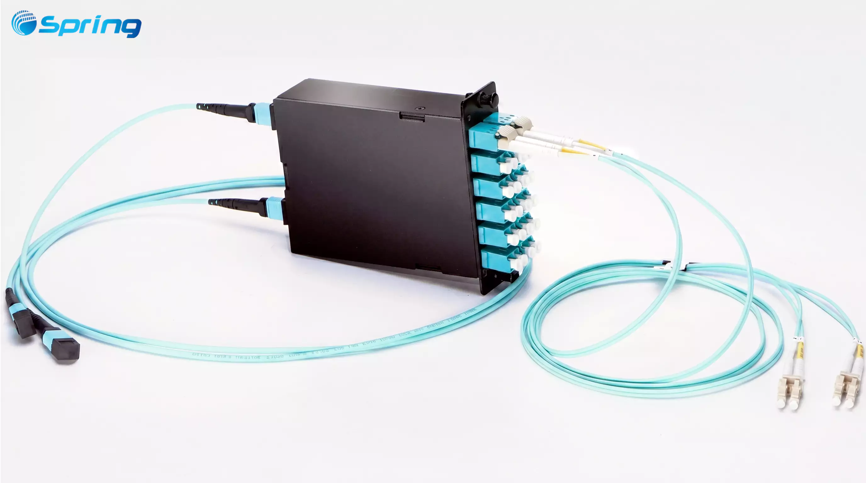 A black MTP cassette module with several aqua LC duplex adapters on the front and MTP trunk cables connected to the rear for structured cabling breakout.